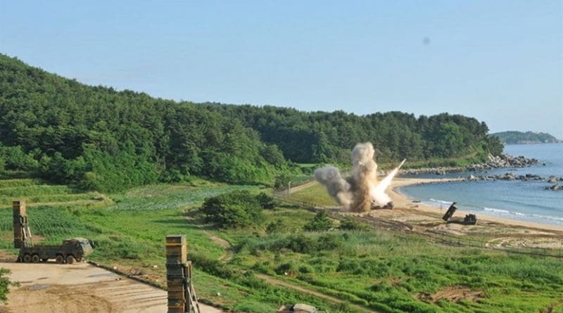 An M270 Multiple Launch Rocket System from 1st Battalion, 18th Field Artillery Regiment, 210th Field Artillery Brigade, 2nd Republic of Korea/United States Combined Division, fires an MGM-140 Army Tactical Missile into the Sea of Japan, July 5, 2017. In the foreground, two mobile carriers prepare to launch South Korean Hyunmoo II missiles. The missile launches demonstrated the combined deep strike capabilities which allow the South Korean-U.S. alliance to neutralize hostile threats and aggression against South Korea, the U.S. and other allies. Army photo