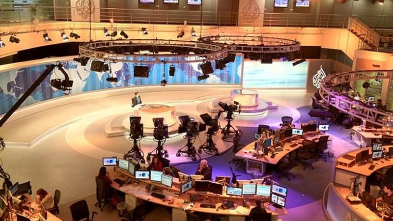 Photo from balcony overlooking Al Jazeera's main television studio towards presenter's desk in the Doha, Qatar headquarters. Photo by Wittylama, Wikimedia Commons.