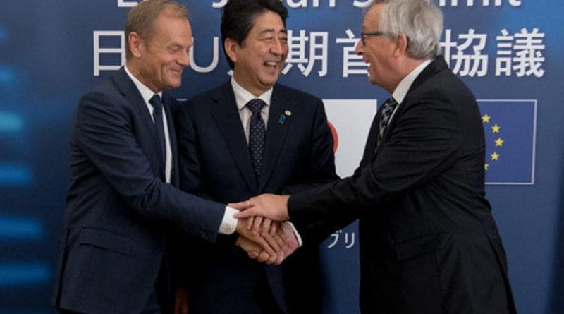 European Council President Donald Tusk (L), Japanese Prime Minister Shinzo Abe (C) and Commission chief Jean-Claude Juncker celebrate the signing of a political agreement on a much-vaunted trade deal. [European Commission]