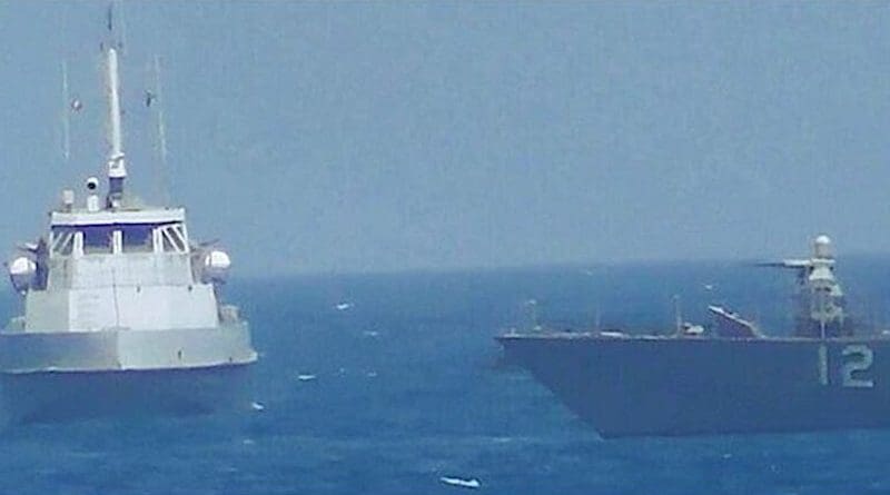 An Iranian naval vessel makes a close approach to the coastal patrol ship USS Thunderbolt, right, in international waters in the Persian Gulf, July 25, 2017. The Thunderbolt crew sounded warnings before firing warning shots. Navy photo