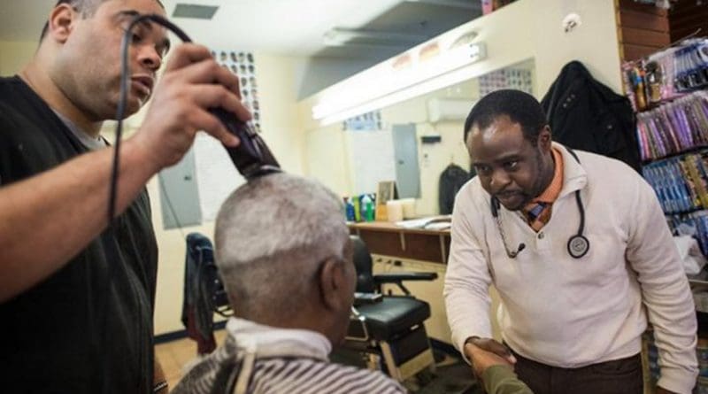 Dr. Joseph Ravenell talks to patrons of a New York City barbershop Credit NYU Langone Health