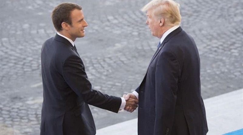 French President Emmanuel Macron welcomes President Donald J. Trump to the reviewing stand for the Bastille Day military parade in Paris, July 14, 2017. Macron and Trump recognized the continuing strength of the U.S.-France alliance from World War I to today. DoD photo by Navy Petty Officer 2nd Class Dominique Pineiro