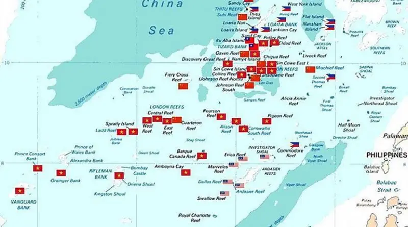Spratly islands map showing occupied features marked with the flags of countries occupying them. Source: Wikipedia Commons