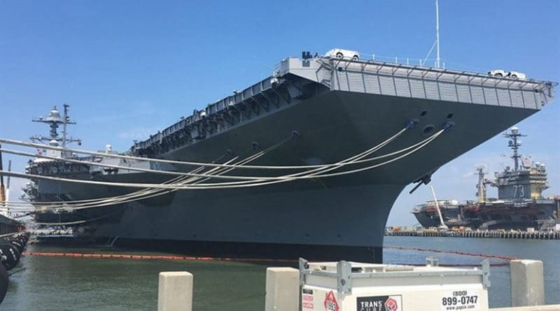 The aircraft carrier Gerald R. Ford is docked at Pier 11, Naval Station Norfolk, Va., June 30, 2017. The ship was undergoing preparations for its commissioning ceremony. The aircraft carrier USS George Washington is at background right. DoD photo by Thomas M. Ruyle