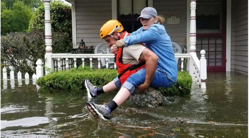 A Texas National Guardsman carries a resident from her flooded home following Hurricane Harvey in Houston, Aug. 27, 2017. President Donald J. Trump, who previously declared a state of emergency in Texas, declared on Aug. 28, 2017, that an emergency exists in the state of Louisiana and ordered federal assistance to supplement state, tribal, and local response efforts due to the emergency conditions resulting from Tropical Storm Harvey. Army National Guard photo by Lt. Zachary West