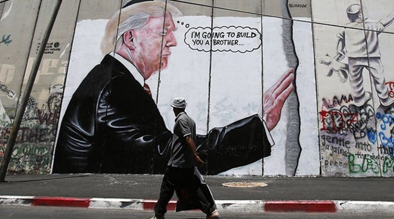 Graffiti resembling that of British street artist Banksy has appeared on Israel’s concrete security barrier in the West Bank city of Bethlehem. Photo via MINA.