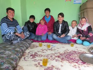Ghulam ( fourth from left ) with his siblings and Ali ( fifth from left )