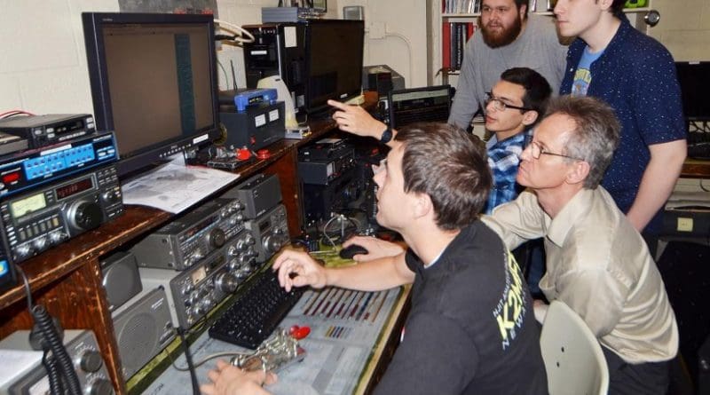 Members of NJIT's ham radio club preparing for the eclipse. From left to right - Nathaniel Frissell, Peter Teklinski, director of Core Systems and Telecommunications for NJIT and club adviser, Spencer Gunning (standing) Joshua Vega (sitting) and Joshua Katz (standing). Credit New Jersey Institute of Technology