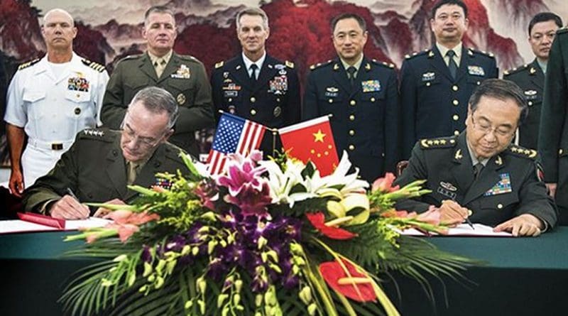 Marine Corps Gen. Joseph F. Dunford Jr., chairman of the Joint Chiefs of Staff, signs the Joint Staff Dialogue Mechanism with his Chinese counterpart Gen. Fang Fenghui following a roundtable discussion at the Ba Yi, Aug. 15, 2017. (DOD photo by U.S. Navy Petty Officer 1st Class Dominique A. Pineiro)