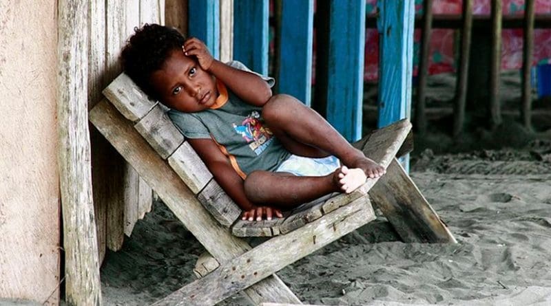 Child from the La Barra neighborhood, beach near Buenaventura, Colombia. Photo by Quinaya Qumir, Wikimedia Commons.