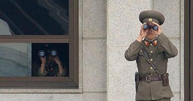 Soldiers from the North Korean People's Army look south while on duty in the Joint Security Area. Photo by Edward N. Johnson, US Military, Wikipedia Commons.