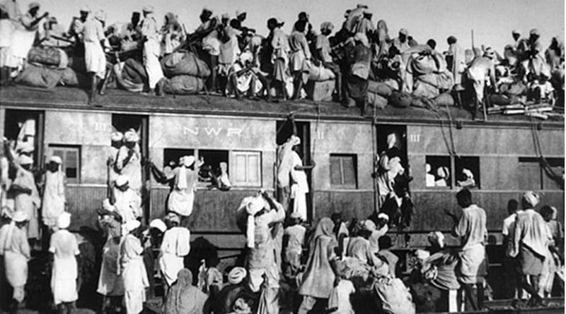 An overcrowded train carrying refugees during the partition of India in 1947. This is considered to have been the largest migration in human history. It forced millions of people to be displaced. Source: Wikipedia Commons.