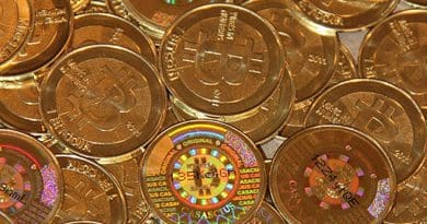 Bitcoins. Photo by Mike Cauldwell, Wikimedia Commons.