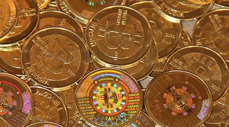 Bitcoins. Photo by Mike Cauldwell, Wikimedia Commons.