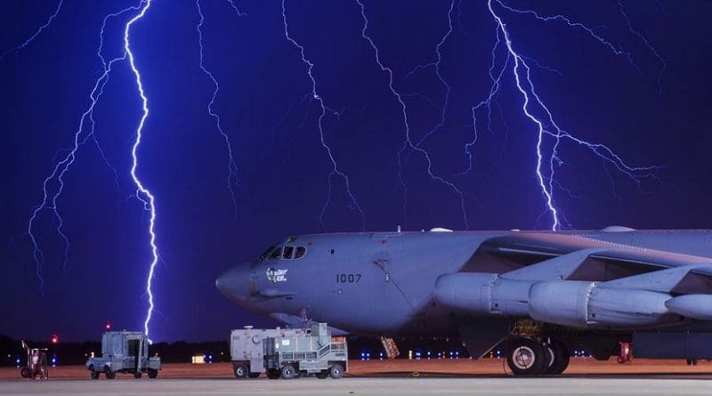 Lightning strikes behind a B-52H Stratofortress at Minot Air Force Base, N.D., Aug. 8, 2017. The B-52 can conduct strategic attacks, close-air support, air interdiction, offensive counter-air and maritime operations. Air Force photo by Senior Airman J.T. Armstrong