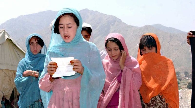 An Afghan school girl sings a prayer in celebration and for blessing. Photo Credit: US Army, Wikipedia Commons.