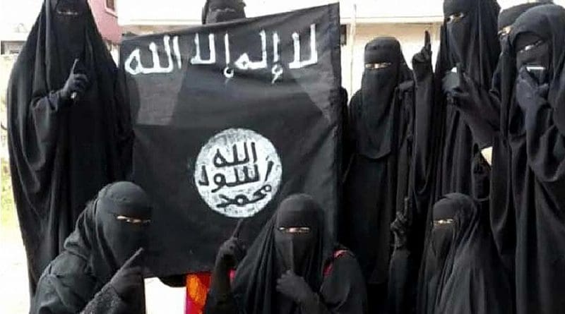 Women holding Islamic State flag.