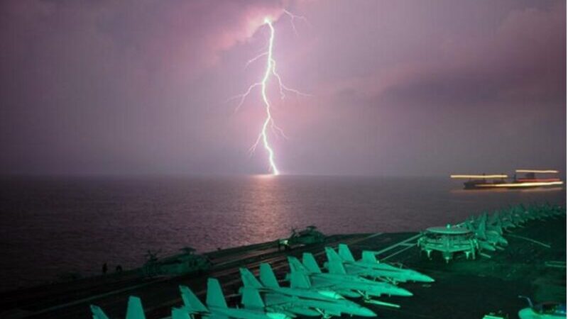 This is lightning behind an aircraft carrier in the Strait of Malacca. Credit: pxhere.com