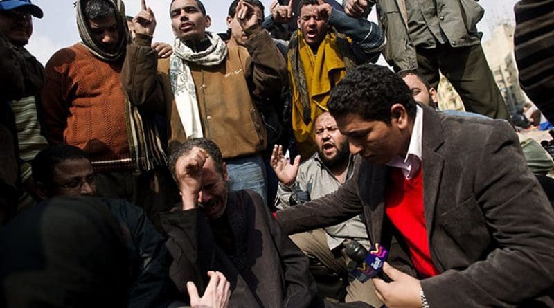 An Alhurra reporter interviews Egyptian protesters. Photo by Deirdre Kline, Wikipedia Commons.