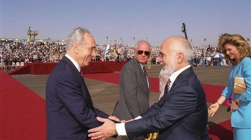 Israel's Foreign Minister Shimon Peres and King Hussein greet each other at the Arava border terminal prior to the signing of the Peace Treaty between their countries. (Government Press Office, Israel)