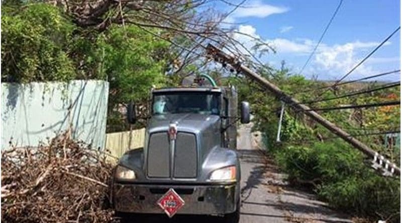 A fuel truck contracted by the Defense Logistics Agency makes its way through fallen electrical poles and downed trees in Puerto Rico, Oct. 17, 2017. Restoration efforts for power outages caused by Hurricanes Maria and Irma continue across the island. DoD photo