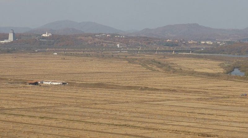 The Friendship Bridge linking North Korea and Russia. Korea is in the foreground and Khasan is on the right. The tower on the left is in Chinese territory. Photo by Muso555, Wikipedia Commons.