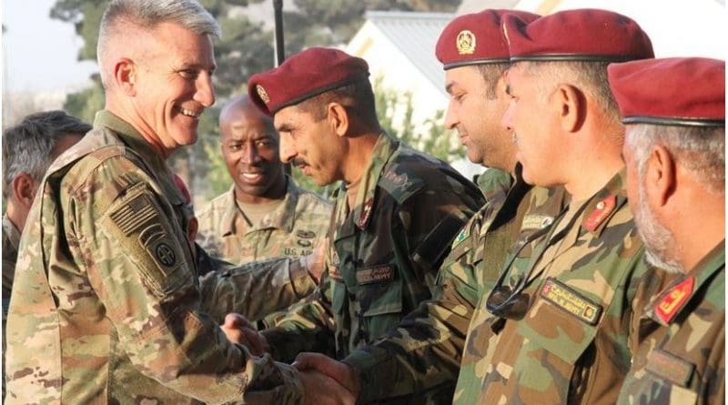 Army Gen. John W. Nicholson, NATO Resolute Support commander, greets Afghan Special Operations Command School of Excellence leaders before receiving an overview of the commando class final tactical exercise and a platoon-level raid demonstration at Camp Command, Kabul, Afghanistan, Oct. 21, 2017. Army photo by Spc. Jacob Krone