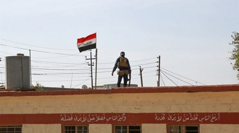 An Iraqi federal police officer provides security for students at a primary school in Aski Mosul, Iraq, Nov. 13, 2017. Army photo by Army Sgt. Tracy McKithern