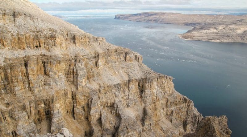 The Angmaat Formation above Tremblay Sound on the Baffin Island coast. Bangiomorpha pubescens fossils occur in this roughly 500-meter thick rock formation. CREDIT: Timothy Gibson