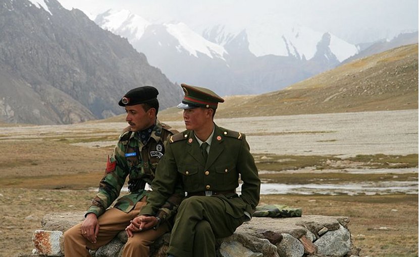 Chinese and Pakistan border guards at Khunjerab Pass. Photo by Anthony Maw, Wikimedia Commons.