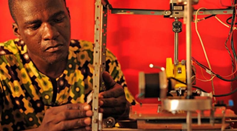 Afate Gnikou, award-winning inventor from Togo, demonstrates his 3-D printer made from e-waste.