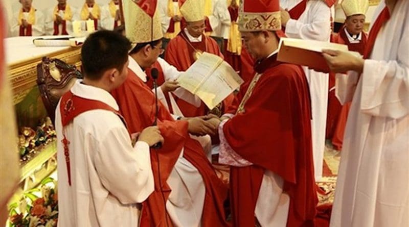 Excommunicated Huang Bingzhang of Shantou (kneeling) accepted an illegal bishop ordination on July 14, 2011, and was punished by the Holy See two days later. (Photo supplied via UCAN)