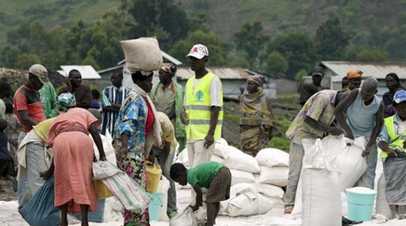 Residents of the camp of the Internally Displaced Persons (IDPs) receive food rations distributed by the World Food Programme (WFP) in collaboration with an international non-governmental organization, CARITAS. North Kivu, Democratic Republic of the Congo. Photo: Flickr/UN Photo/Marie Frechon