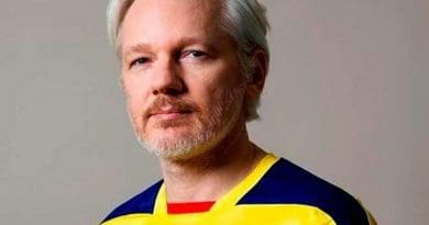 Julian Assange in photo uploaded to his Twitter account wearing Ecuadoran colors.