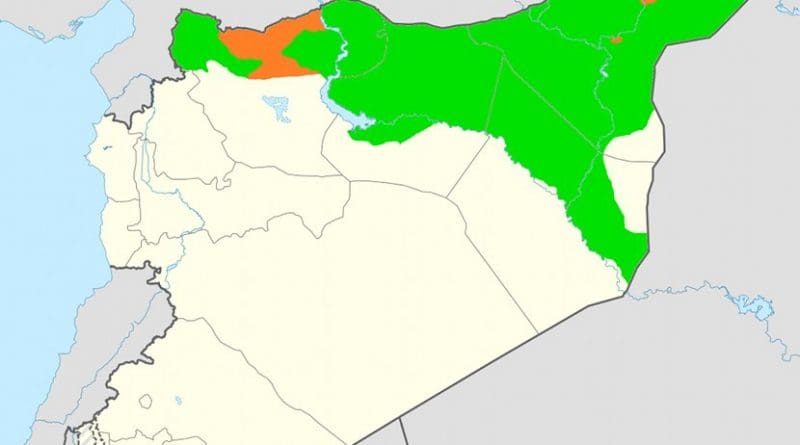 Claimed territory of Rojava (in orange) not currently under control and the de facto territory controlled by the Syrian Democratic Forces (in green). Source: Wikipedia Commons.