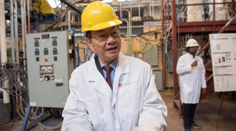 L.S. Fan, Distinguished University Professor in Chemical and Biomolecular Engineering at The Ohio State University, holds samples of materials developed in his laboratory that enable clean energy technologies. Credit Photo by Jo McCulty, courtesy of The Ohio State University.