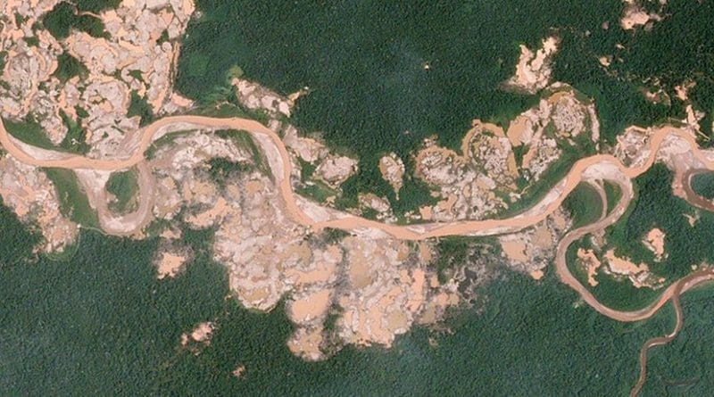 The sprawling "La Pampa" gold mine has grown quickly over the years. In 2016, however, the mine spilled south of the Malinowski River, illegally entering the Tambopata National Reserve—a protected forest. The Amazon Conservation Association used Planet data to publish a series of alerts which tracked hundreds of hectares of illegal expansion and mapped alterations to the course of the Malinowski River. The Peruvian government has intervened and is now actively targeting illegally cited mining equipment inside the reserve. Photo by Planet Labs, Inc., Wikimedia Commons.
