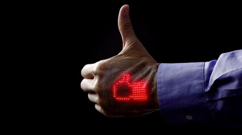An integrated "skin electronics" system allows health monitoring at home and gives doctors remote access to biometric data transmitted wirelessly to a medical cloud. It promises to enhance self-care and accessibility of medical information to various segments of the population, including children and the elderly. A thumbs-up image on the skin display serves as an indicator of good health. Credit 2018 Takao Someya Research Group.
