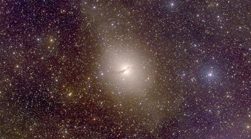 Centaurus A, an elliptical galaxy 13 million light-years from Earth, hosts a group of dwarf satellite galaxies co-rotating in a narrow disk, a distribution not predicted by dark-matter-influenced cosmological models. Credit Christian Wolf and the SkyMapper team / Australian National University