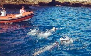 Heading to Morocco: wife Kim Craige in the Zodiac, Lesley Fanning swimming on left and author on right