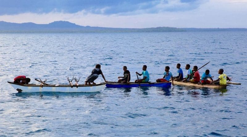 Young men in canoes in Northwest Malakula, Vanuatu. Credit Russell Gray & Heidi Colleran