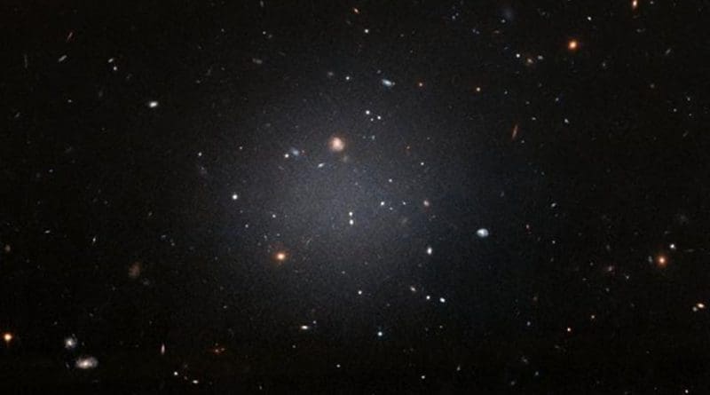 NGC 1052-DF2 resides about 65 million light-years away in the NGC 1052 Group, which is dominated by a massive elliptical galaxy called NGC 1052. Credit NASA, ESA, and P. van Dokkum (Yale University)