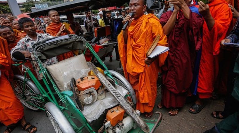 But Buntenh speaks outside the Forestry Administration’s headquarters in Phnom Penh last year as monks display chainsaws seized from illegal loggers in the Prey Lang forest. Courtesy: Siv Channa | The Cambodia Daily