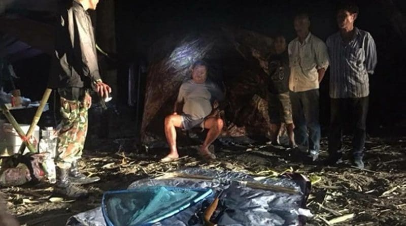 Thai authorities place business tycoon Premchai Karnasuta (sitting) and three of his alleged associates under arrest at a hunting camp in Thungyai Naresuan Wildlife Sanctuary in Kanchanaburi province, Feb. 4, 2018 (Courtesy of Thungyai Naresuan Wildlife Sanctuary)