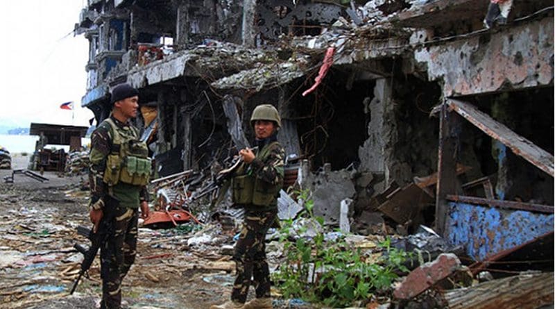 Philippine troops guard the former scene of the main battle area in the southern Philippine city of Marawi, which remains off-limits to civilians. Photo Credit: Richel V. Umel, Benar News