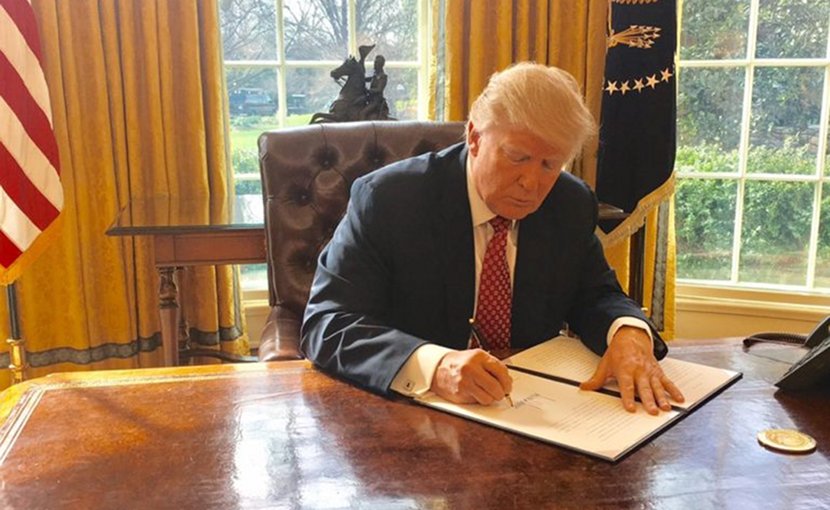 US President Trump signing Executive Order 13780. Photo Credit: White House.