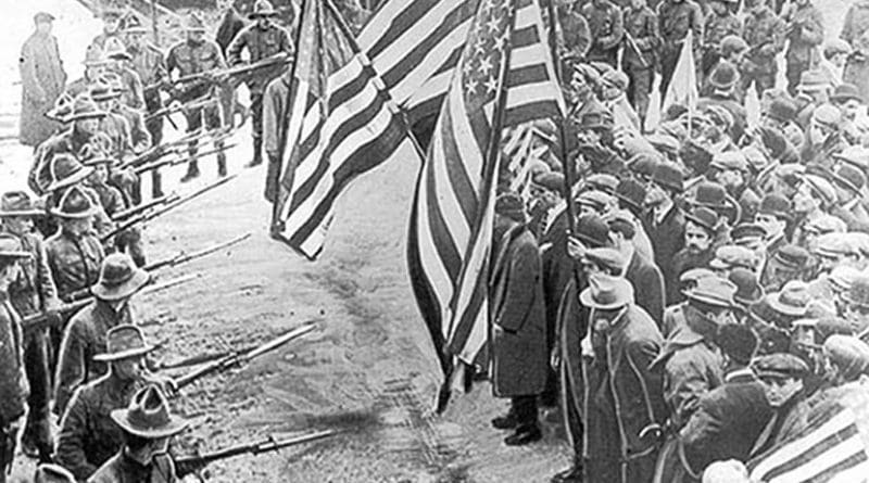 Labour union demonstrators of the Industrial Workers of the World held back by soldiers, during the 1912 Lawrence textile strike in Lawrence, Massachusetts. Source: Wikimedia Commons.