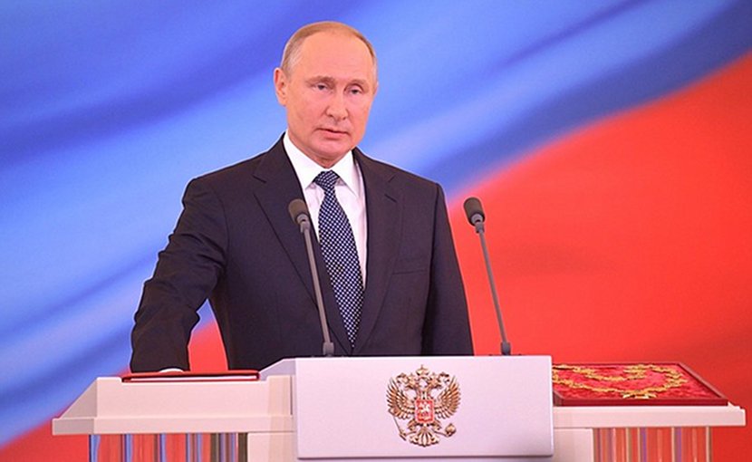 Russia's President Vladimir Putin takes the oath of office on a copy of the Russian Constitution. Photo Credit: Kremlin.ru