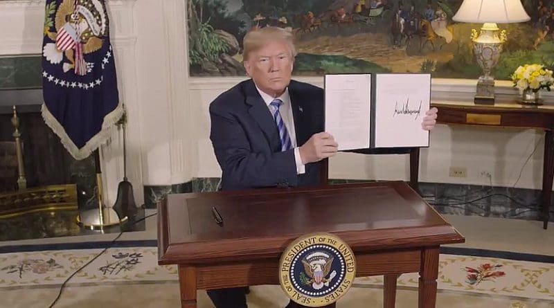 US President Donald Trump signs a Presidential Memorandum on the Iran nuclear deal. Photo Credit: White House video screenshot.