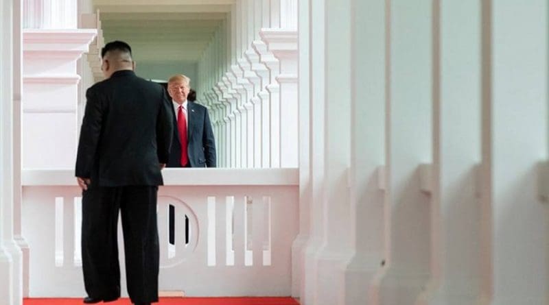 President Donald J. Trump watches as North Korean leader Kim Jong Un, walks toward him for their first-ever meeting, Tuesday, June 12, 2018, at the Capella Hotel in Singapore. (Official White House Photo by Stephanie Chasez)